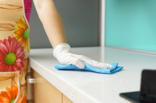 Carpet cleaning staff applying safe working practices during a routine service