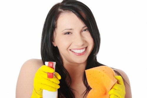 Technician handling cleaning products with care as part of carpet cleaner safety